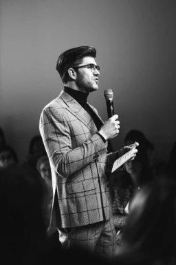 man standing while holding microphone